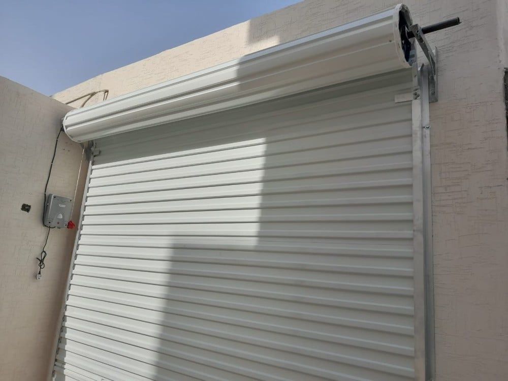 صيانه وتوريد وتركيب ابواب الكراج ونوافذ الشتر الكه